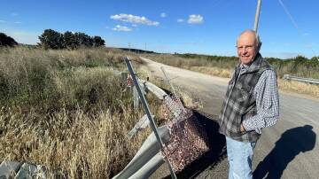 Resident Stuart Clarke says by raising awareness he hopes to see safety guard rails such as the one on White's Road in west Griffith replaced. Picture by Allan Wilson
