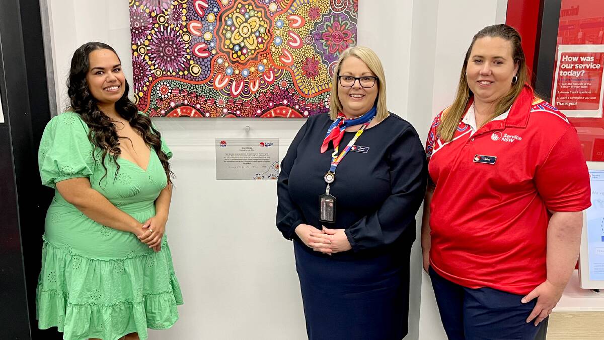 Artist Amy Kilby with Service NSW Griffith's centre manager Casey Wolfe and Alicia Hornbuckle. Picture supplied