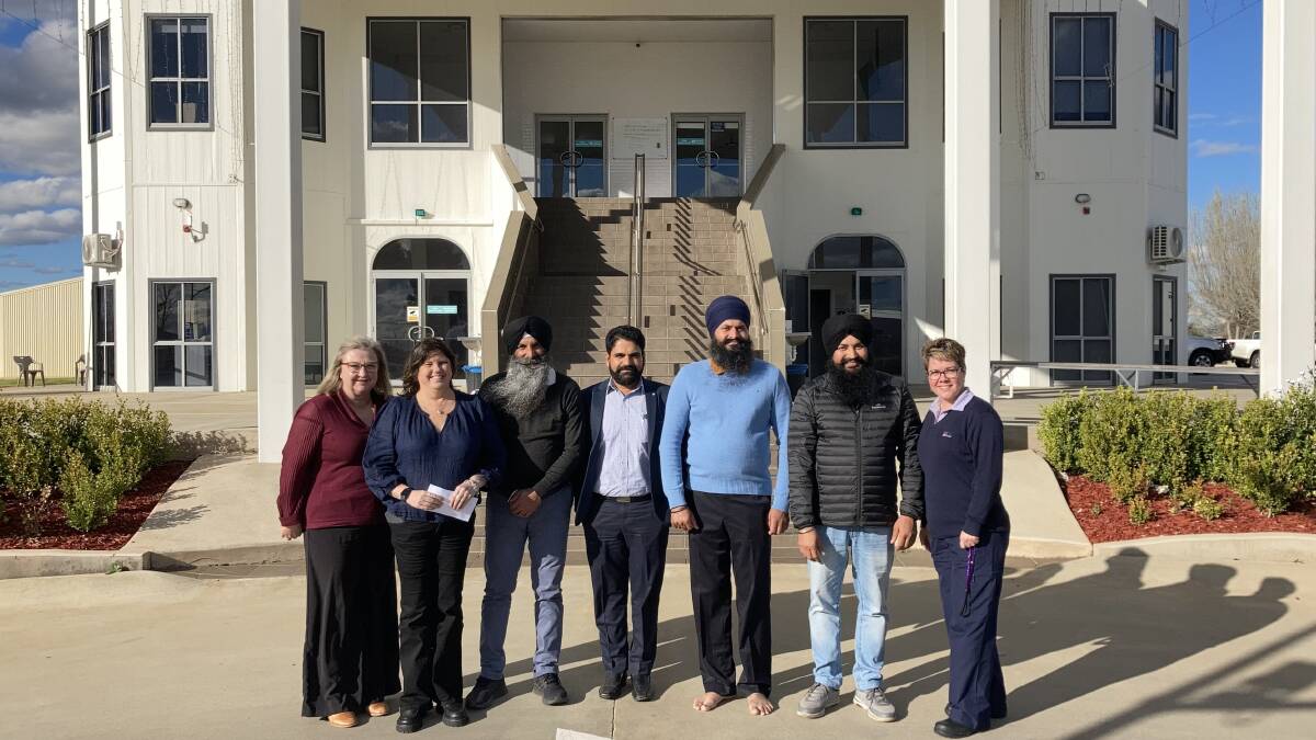 Hospital staff and the Gurdwara Singh Sabha Society's committee at the Sikh Temple. Picture by Cai Holroyd