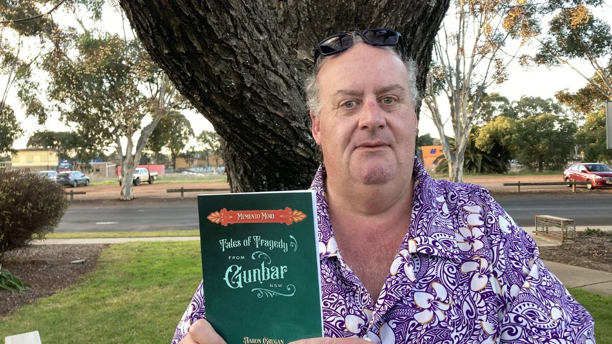 Writer Aaron Grugan with his latest book - 'Memento Mori: Tales of Tragedy from Gunbar NSW.' Picture by Cai Holroyd