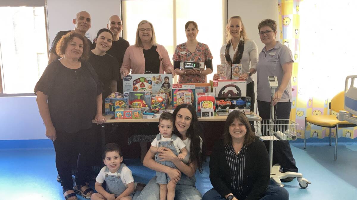 The La Piccola Grosseria family and staff from Griffith Base Hospital met to celebrate the successful fundraiser. Picture by Cai Holroyd