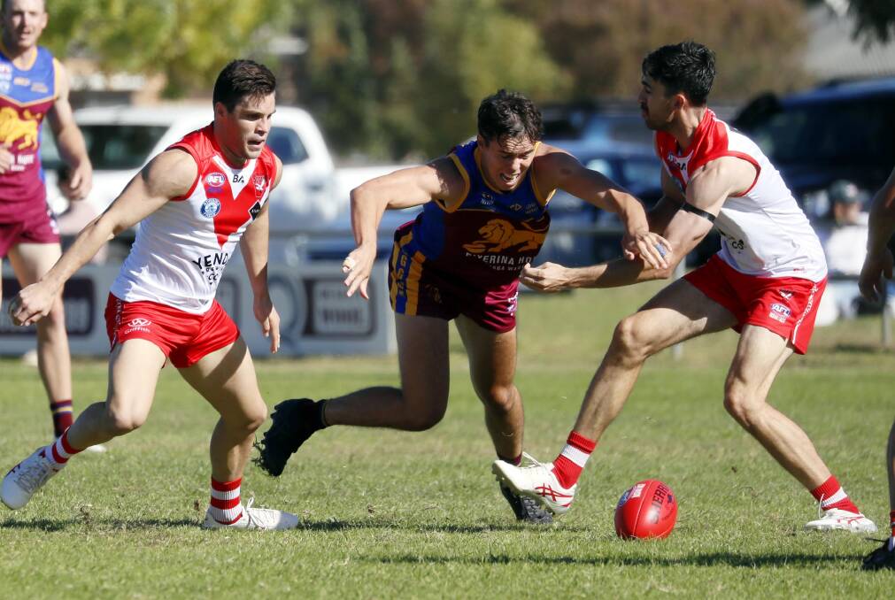 GGGM's Tom Banuelos and Griffith's Rhys Pollock attack the footy during the Swans' big win at Ganmain Sportsground. Picture by Les Smith
