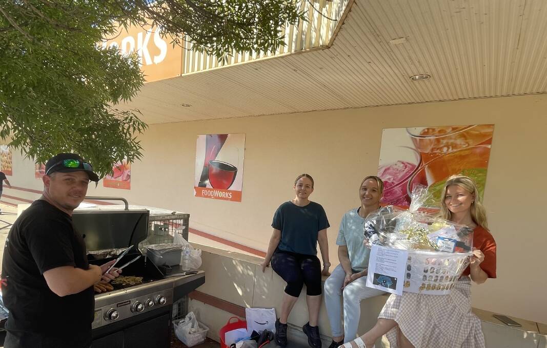 Gary, Antonina, and Jacinta Pennisi with Aleah Vantongeren tend the barbecue held at Rossies Foodworks on Sunday. The fundraiser was part of a goal to fetch $10,000 for Leukaemia Support Queensland. If successful, Antonina will feature in the award-winning TV program 'Adventure All-Stars.'