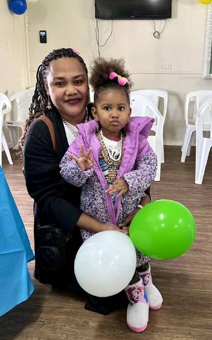 Solomon Islands Griffith Community Association secretary Francina Wilikai and daughter Denisna enjoying the event on Saturday. Picture supplied. 