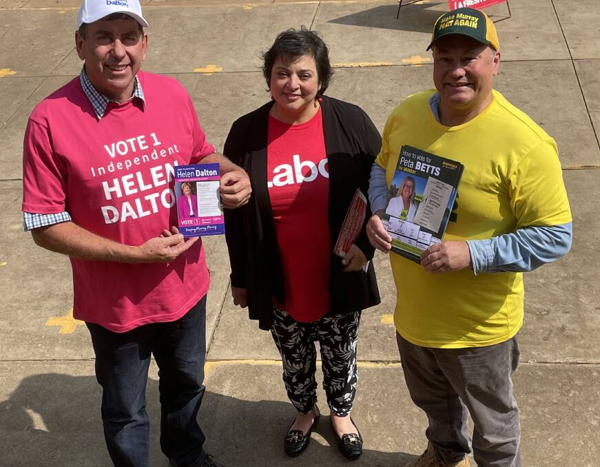 PAULS COME TOGETHER: Helen Dalton volunteer Paul Rossetto, Labor volunteer Paulette Catanzariti and Nationals volunteer Paul Baker at the voting center at Griffiths Uniting Church. Picture Allan Wilson 