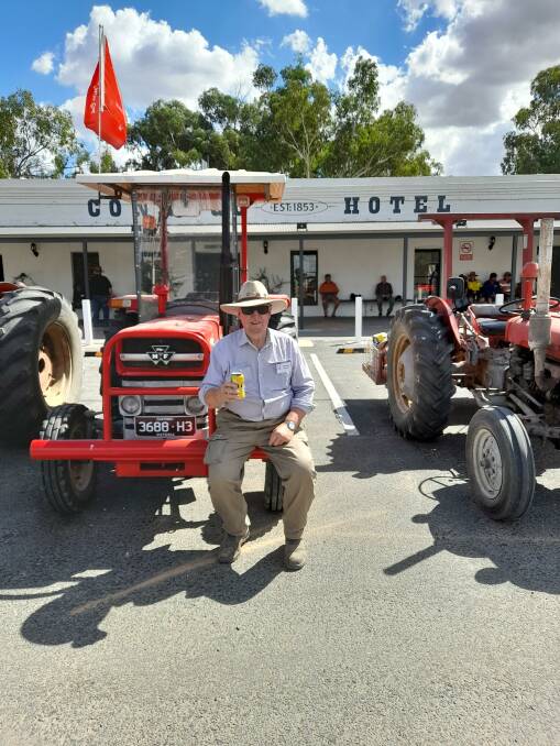 Two Rivers participant Russell Sanders with some of the vintage tractors at the Conargo Pub. Picture supplied