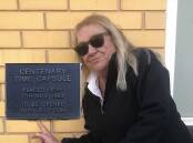 Organiser Angela Masters points out the time capsule plaque established in the 1980s. Picture supplied.