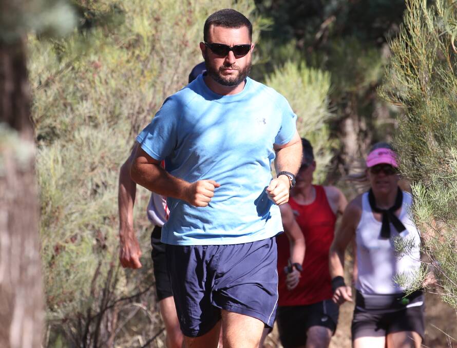 IN FRONT: Anthony Trefilo leads a pack of runners across Scenic Hill on Saturday. PHOTO: Anthony Stipo