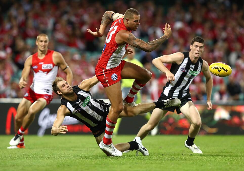 TOUGH CONTEST: Lance Franklin, of the Swans, competes for the ball against Ben Reid, of the Magpies, in their one-point thriller last weekend. Picture: Ryan Pierse/Getty Images
