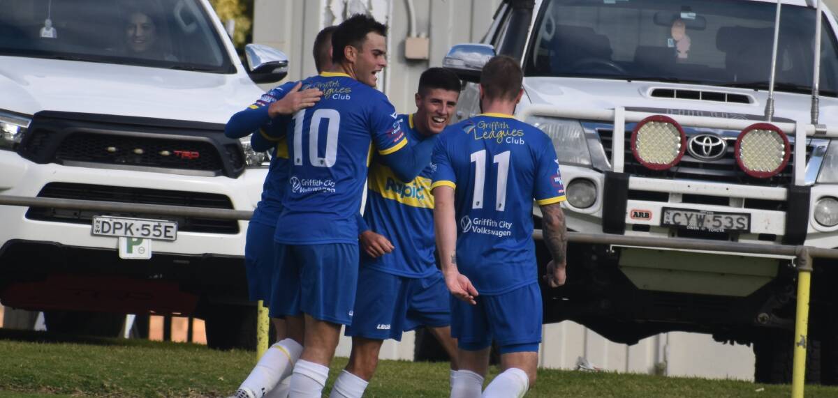 Yoogali SC celebrate Mason Donadel's match winner which sees the home side remain in top spot after a 2-1 win over Brindabella Blues. Picture by Liam Warren