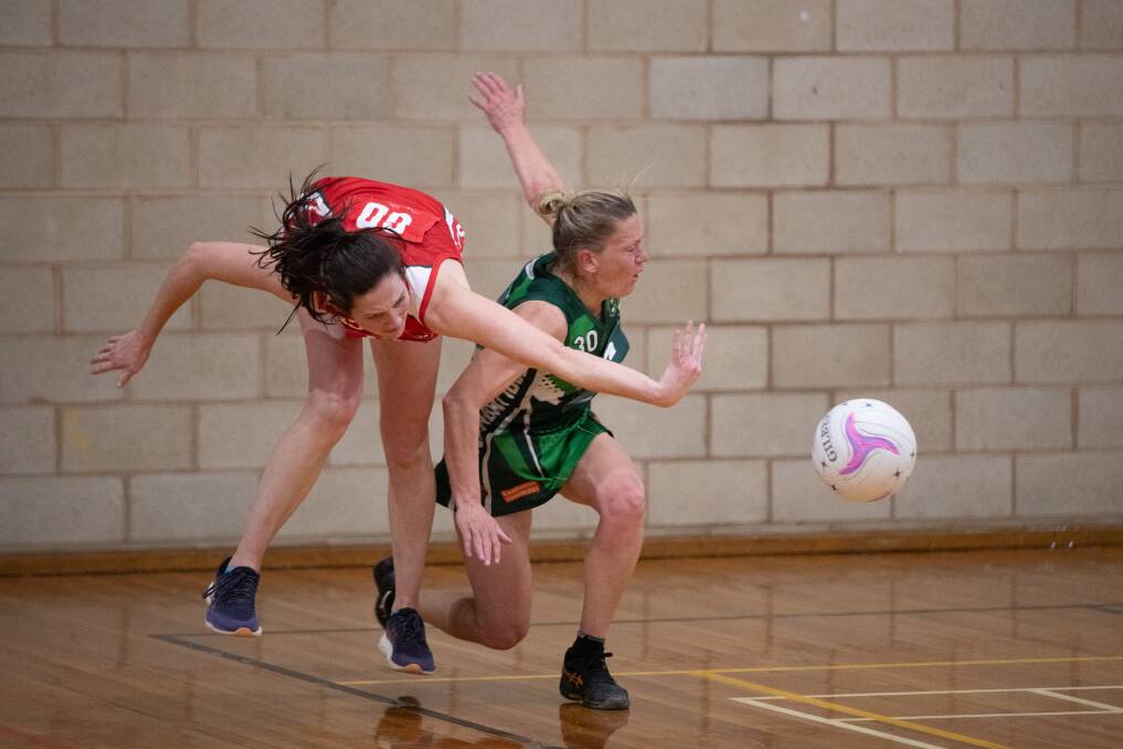 Swans' Joh Munro and Coolamon's Kirsty Lowe contest the ball but Lowe is called for contact. Picture by Madeline Bagley