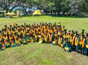 The PNG graduates celebrate their achievements after a special ceremony. Picture supplied 